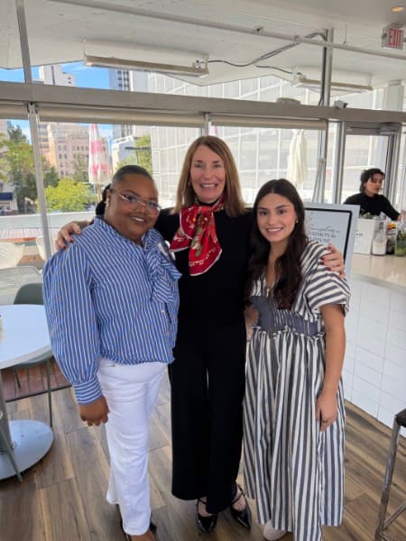 Nancy Moore with two guests at The Vault